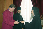His Beatitude offers to Mr. Hiltz a book of manuscripts of the Patriarchal Library