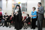 His Beatitude, offering the donation to the Institution.