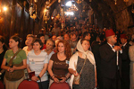 Devout pilgrims standing on the Church steps