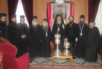 Ο Μακαριώτατος με τον παρασημοφορηθέντα δωρητή και τους ιερείς